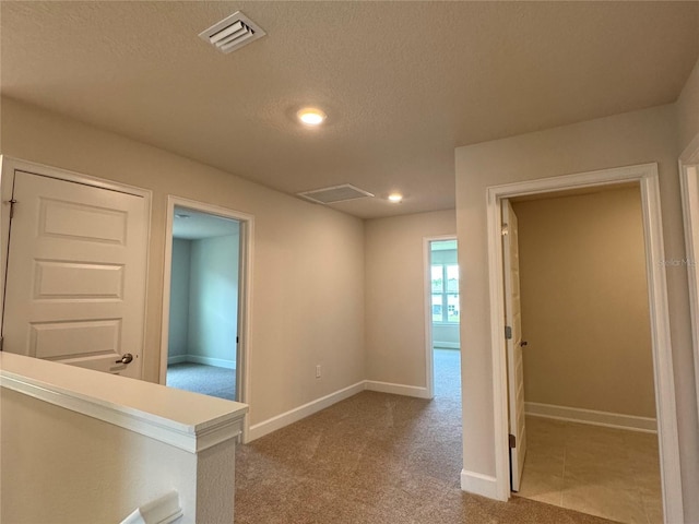 4101 Sagefield Dr, Harmony, FL 34773 - hall featuring a textured ceiling, carpet, and recessed lighting