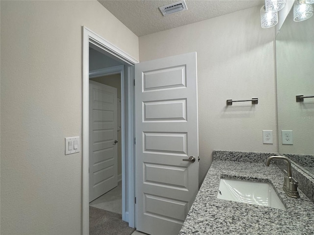 4101 Sagefield Dr, Harmony, FL 34773 - bathroom with vanity and a textured ceiling