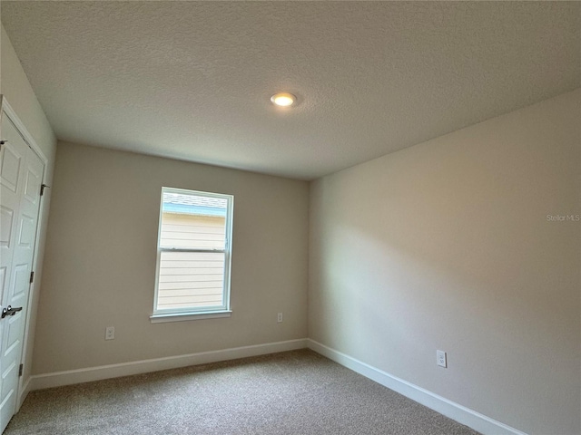 4101 Sagefield Dr, Harmony, FL 34773 - unfurnished room with light colored carpet and a textured ceiling