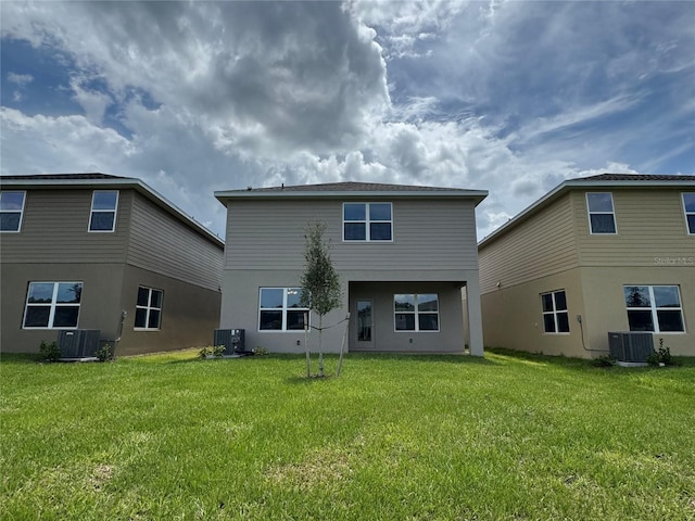 4101 Sagefield Dr, Harmony, FL 34773 - back of house with a lawn and stucco siding