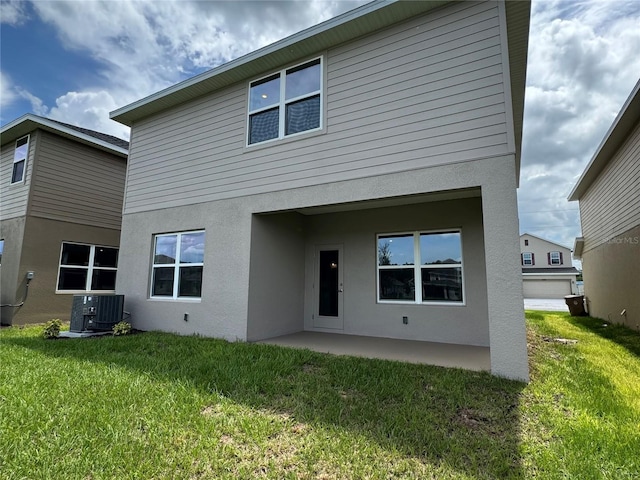 4101 Sagefield Dr, Harmony, FL 34773 - back of property with a patio, stucco siding, and a yard