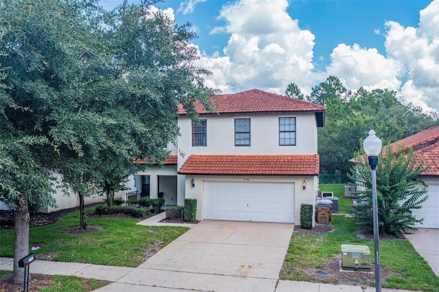 2792 Roccella Ct, Kissimmee, FL 34747 - mediterranean / spanish-style house featuring a tiled roof, stucco siding, and driveway