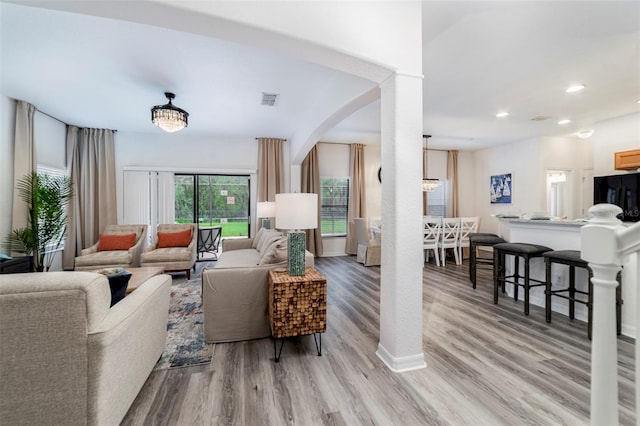 2792 Roccella Ct, Kissimmee, FL 34747 - living area featuring light wood-style floors, recessed lighting, and arched walkways