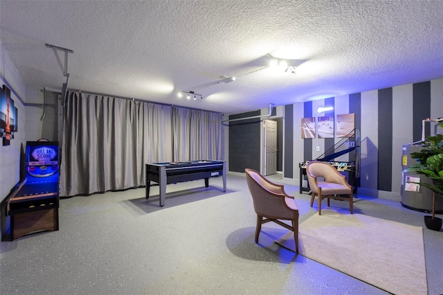 2792 Roccella Ct, Kissimmee, FL 34747 - rec room with water heater and a textured ceiling