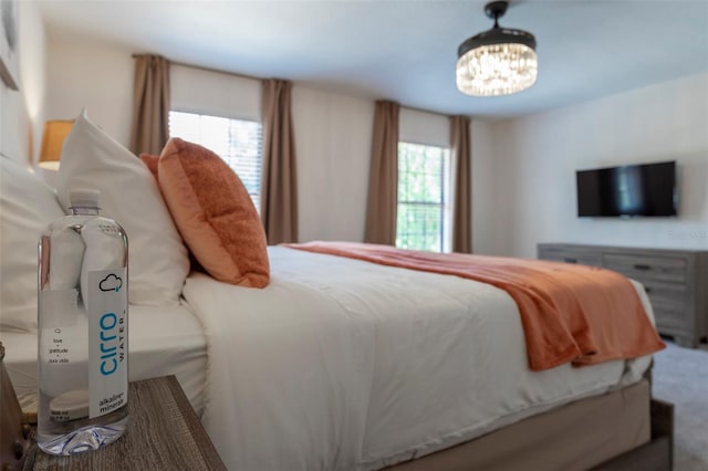 2792 Roccella Ct, Kissimmee, FL 34747 - bedroom with multiple windows and a chandelier