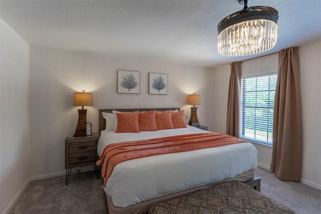 2792 Roccella Ct, Kissimmee, FL 34747 - bedroom featuring carpet floors, a chandelier, and a textured ceiling