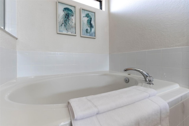 2792 Roccella Ct, Kissimmee, FL 34747 - full bath with a garden tub and a textured wall