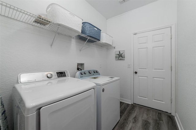 2792 Roccella Ct, Kissimmee, FL 34747 - washroom with separate washer and dryer and dark wood-style floors