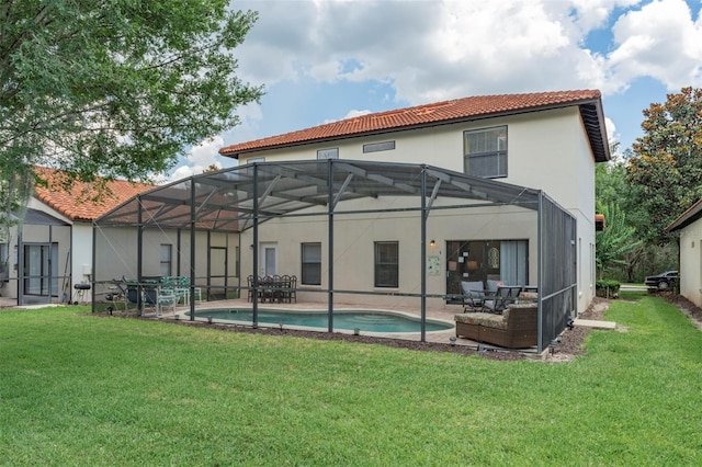 2792 Roccella Ct, Kissimmee, FL 34747 - rear view of house featuring a tile roof, stucco siding, a yard, and a patio area