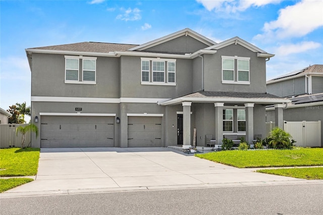 4491 Holstein St, Saint Cloud, FL 34772 - view of front facade featuring a garage, stucco siding, concrete driveway, and a porch