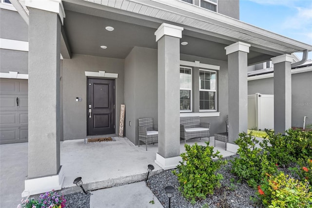 4491 Holstein St, Saint Cloud, FL 34772 - view of exterior entry with a porch and stucco siding