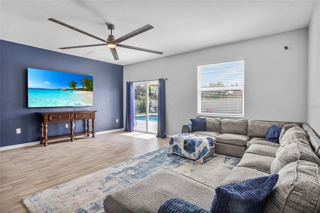 4491 Holstein St, Saint Cloud, FL 34772 - living area with wood finished floors and ceiling fan