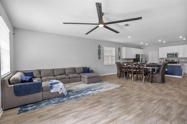 4491 Holstein St, Saint Cloud, FL 34772 - living area with light wood finished floors, recessed lighting, and a ceiling fan