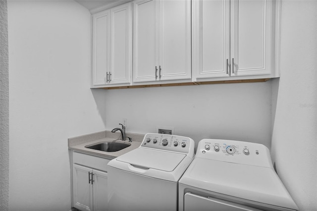 4491 Holstein St, Saint Cloud, FL 34772 - laundry area featuring washing machine and clothes dryer and cabinet space