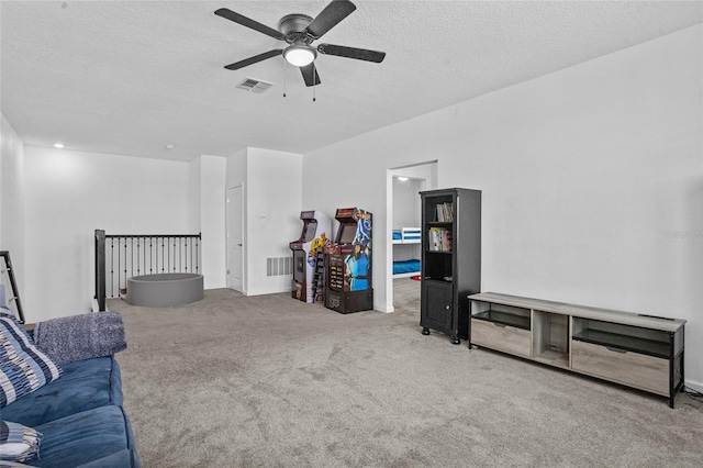 4491 Holstein St, Saint Cloud, FL 34772 - living area featuring ceiling fan, carpet flooring, and a textured ceiling