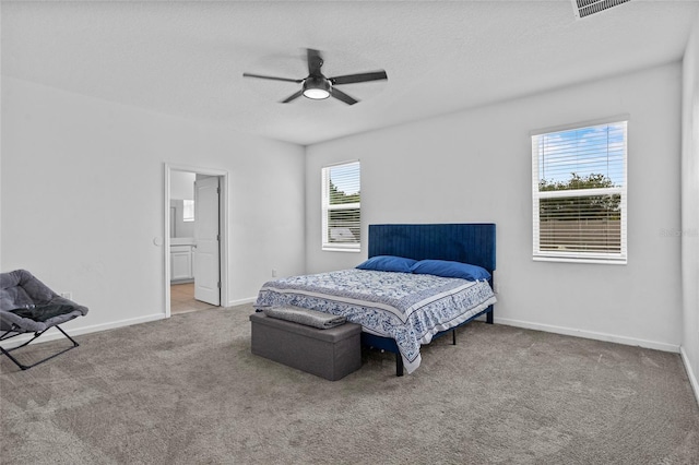 4491 Holstein St, Saint Cloud, FL 34772 - bedroom with carpet, ceiling fan, a textured ceiling, and ensuite bathroom