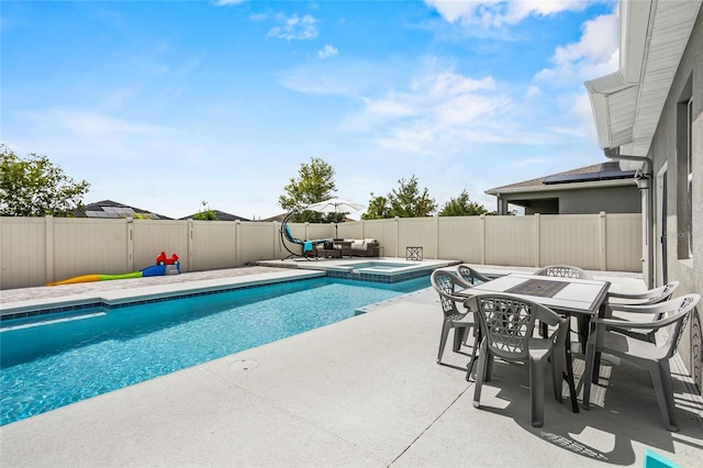 4491 Holstein St, Saint Cloud, FL 34772 - view of pool with a patio area, outdoor dining area, a fenced backyard, and a pool with connected hot tub