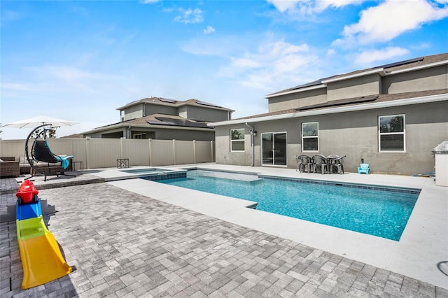 4491 Holstein St, Saint Cloud, FL 34772 - view of pool with a fenced backyard, a patio, a pool with connected hot tub, and outdoor dining space