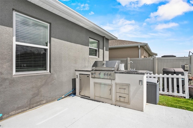 4491 Holstein St, Saint Cloud, FL 34772 - view of patio with exterior kitchen and a sink