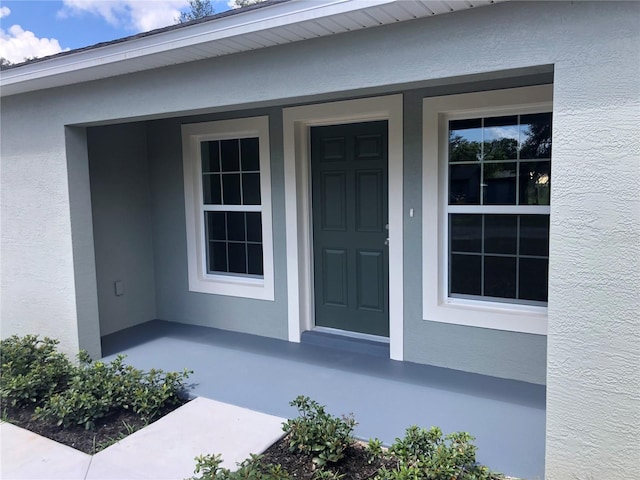 120 Highland Ave, Auburndale, FL 33823 - property entrance with stucco siding and covered porch