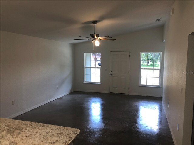 120 Highland Ave, Auburndale, FL 33823 - foyer entrance featuring concrete flooring and a ceiling fan