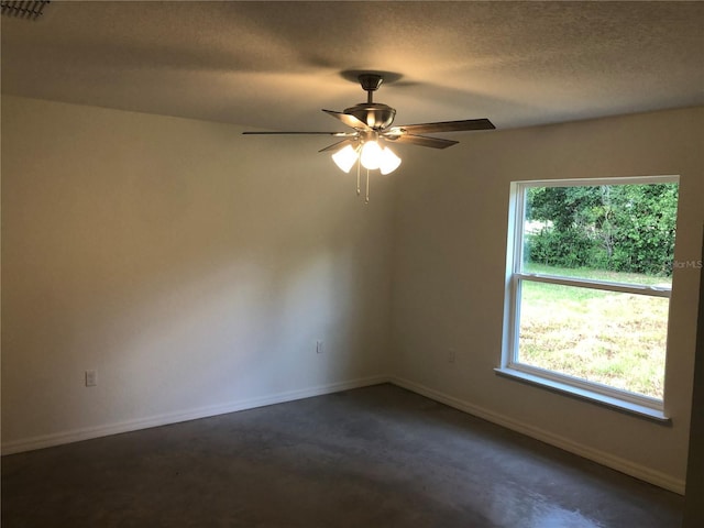120 Highland Ave, Auburndale, FL 33823 - empty room with a textured ceiling, ceiling fan, and dark colored carpet