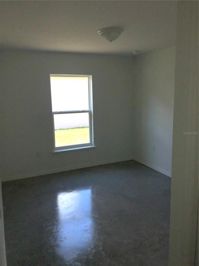 120 Highland Ave, Auburndale, FL 33823 - empty room featuring baseboards and concrete floors