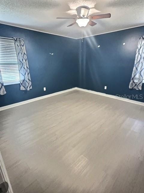 520 Jupiter Blvd NW, Palm Bay, FL 32907 - unfurnished room with ceiling fan, wood finished floors, and a textured ceiling