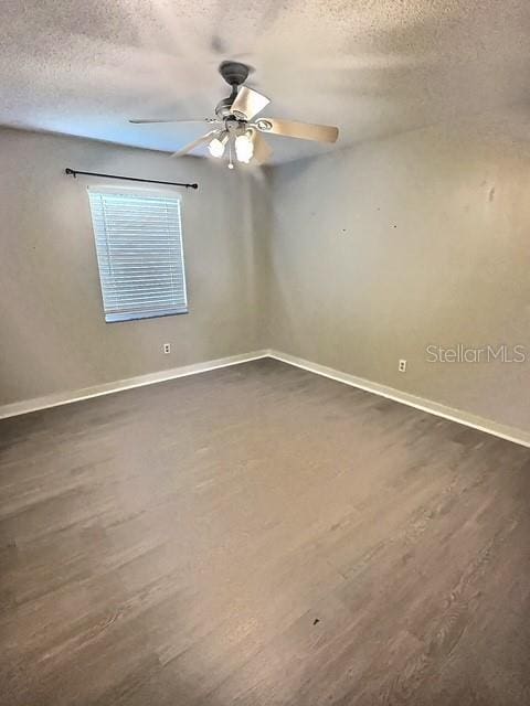 520 Jupiter Blvd NW, Palm Bay, FL 32907 - unfurnished room featuring dark wood finished floors, a textured ceiling, and ceiling fan