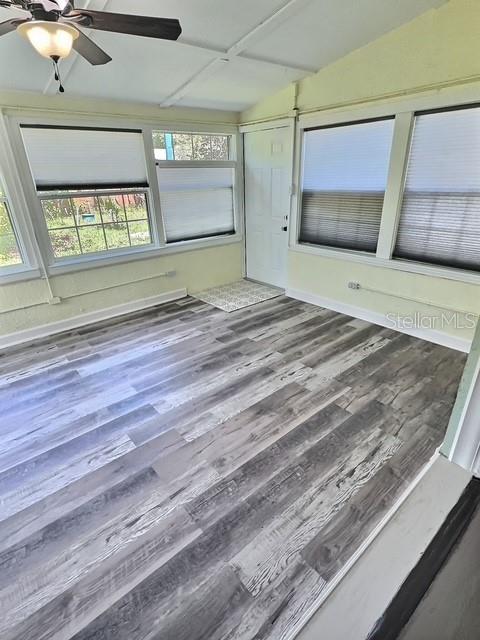 520 Jupiter Blvd NW, Palm Bay, FL 32907 - unfurnished sunroom featuring vaulted ceiling