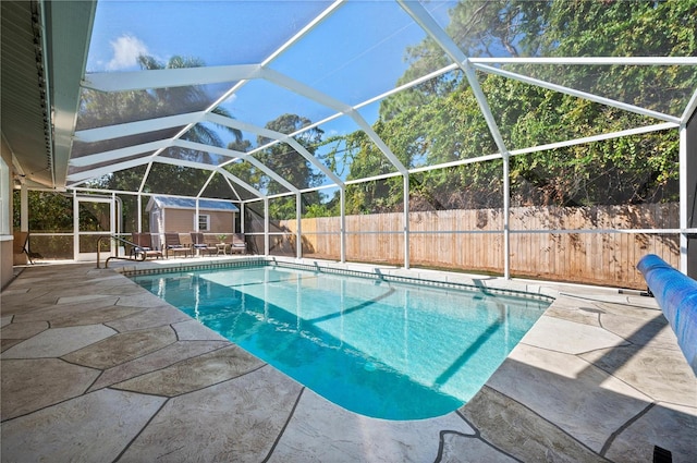 874 Acadia Rd, Venice, FL 34293 - view of pool featuring a shed, a patio, a fenced backyard, and a lanai