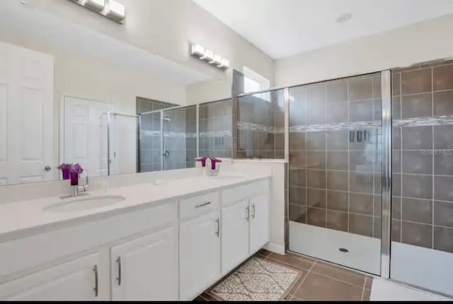 1870 Sawyer Palm Pl Unit 1870, Kissimmee, FL 34747 - bathroom with double vanity, a shower stall, and tile patterned floors