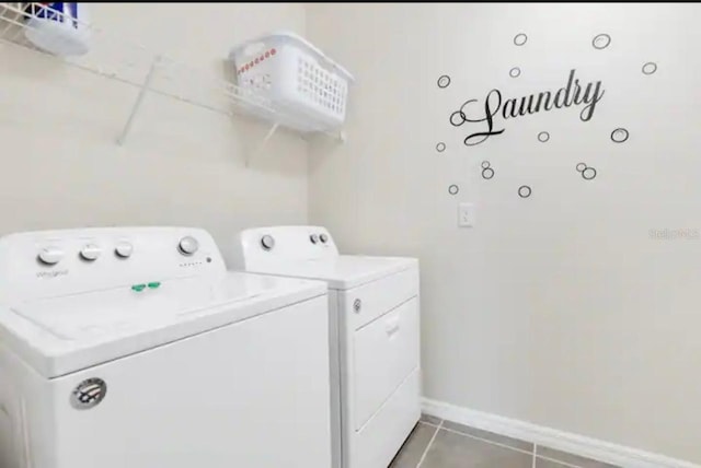 1870 Sawyer Palm Pl Unit 1870, Kissimmee, FL 34747 - laundry room featuring separate washer and dryer and light tile patterned floors
