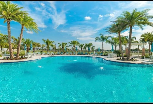 1870 Sawyer Palm Pl Unit 1870, Kissimmee, FL 34747 - community pool featuring a patio area