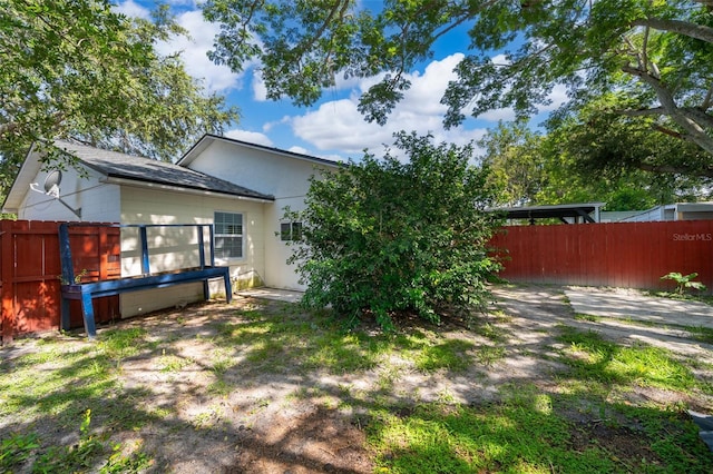 2531 Coral Ave, Kissimmee, FL 34741 - rear view of house featuring stucco siding