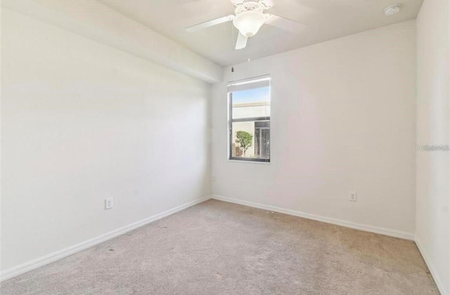 20080 Ragazza Cir Unit 102, Venice, FL 34293 - empty room with light colored carpet, a smoke detector, and ceiling fan