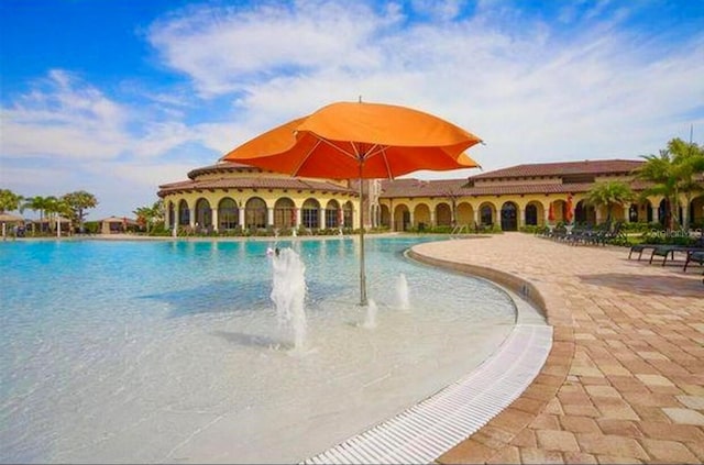 20080 Ragazza Cir Unit 102, Venice, FL 34293 - community pool with a patio area