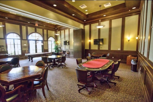 20080 Ragazza Cir Unit 102, Venice, FL 34293 - recreation room with carpet flooring, a decorative wall, healthy amount of natural light, a wainscoted wall, and crown molding