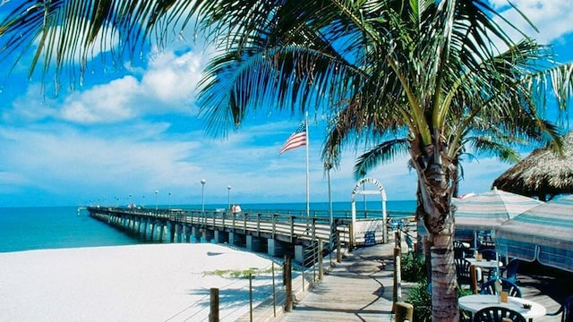 20080 Ragazza Cir Unit 102, Venice, FL 34293 - dock featuring view of water and beach and a pier