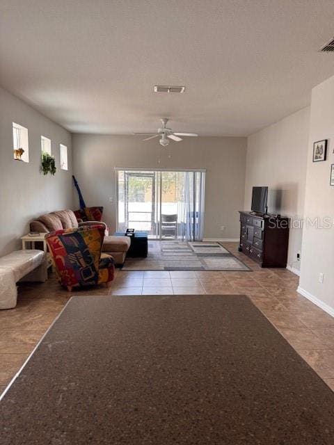 14548 Black Cherry Trl, Winter Garden, FL 34787 - living area with ceiling fan and tile patterned floors