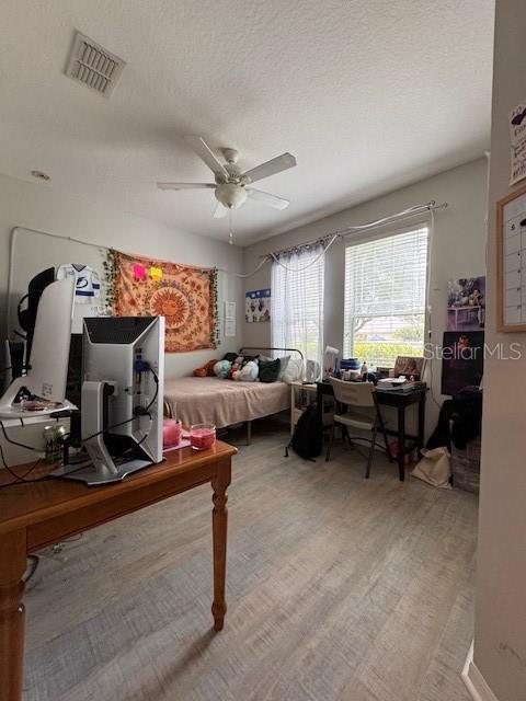 14548 Black Cherry Trl, Winter Garden, FL 34787 - bedroom with a desk and ceiling fan