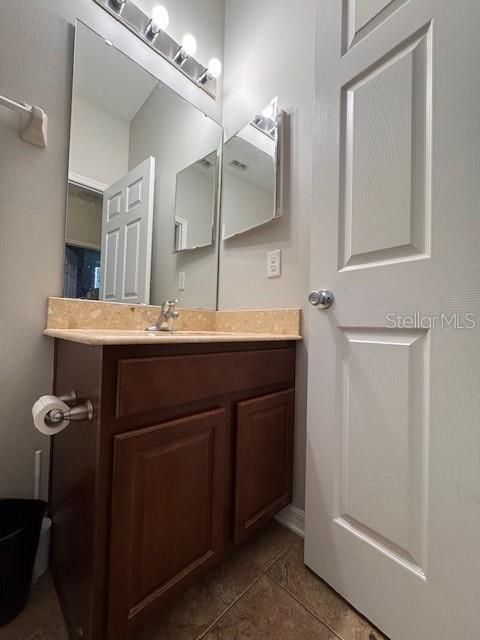 14548 Black Cherry Trl, Winter Garden, FL 34787 - bathroom featuring vanity and tile patterned floors
