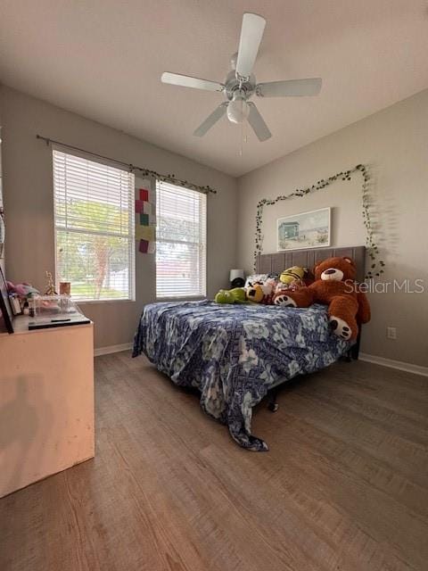 14548 Black Cherry Trl, Winter Garden, FL 34787 - bedroom featuring light wood-style flooring and ceiling fan