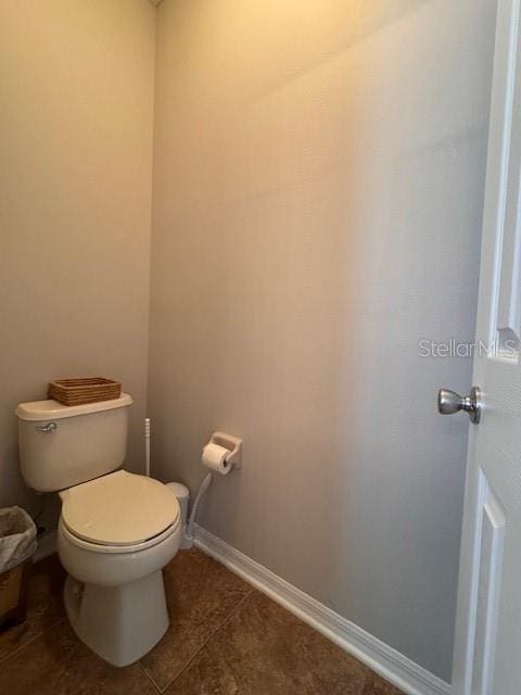 14548 Black Cherry Trl, Winter Garden, FL 34787 - bathroom featuring toilet and tile patterned floors