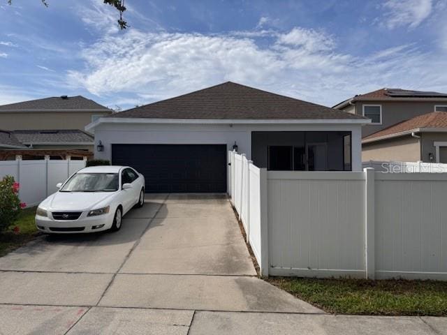14548 Black Cherry Trl, Winter Garden, FL 34787 - view of property exterior with a garage, driveway, a shingled roof, and stucco siding