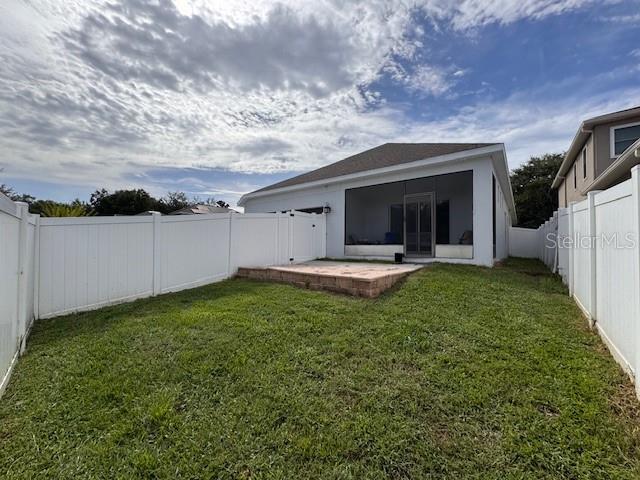 14548 Black Cherry Trl, Winter Garden, FL 34787 - rear view of house with a fenced backyard and a patio
