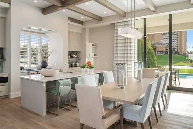 4162 Grande Brick Loop Unit 27, Orlando, FL 32837 - dining space featuring plenty of natural light, beam ceiling, light wood-style floors, and recessed lighting