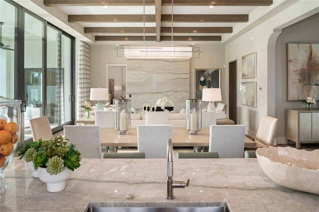 4162 Grande Brick Loop Unit 27, Orlando, FL 32837 - dining space featuring beamed ceiling