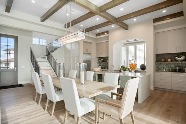 4162 Grande Brick Loop Unit 27, Orlando, FL 32837 - dining room featuring beam ceiling, light wood-type flooring, recessed lighting, stairs, and a towering ceiling
