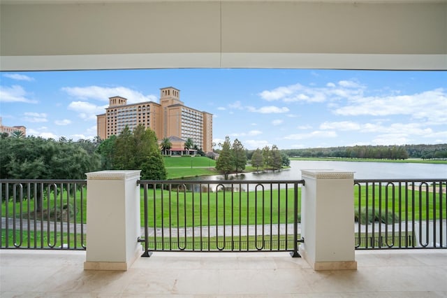 4162 Grande Brick Loop Unit 27, Orlando, FL 32837 - patio / terrace with a water view and a lawn